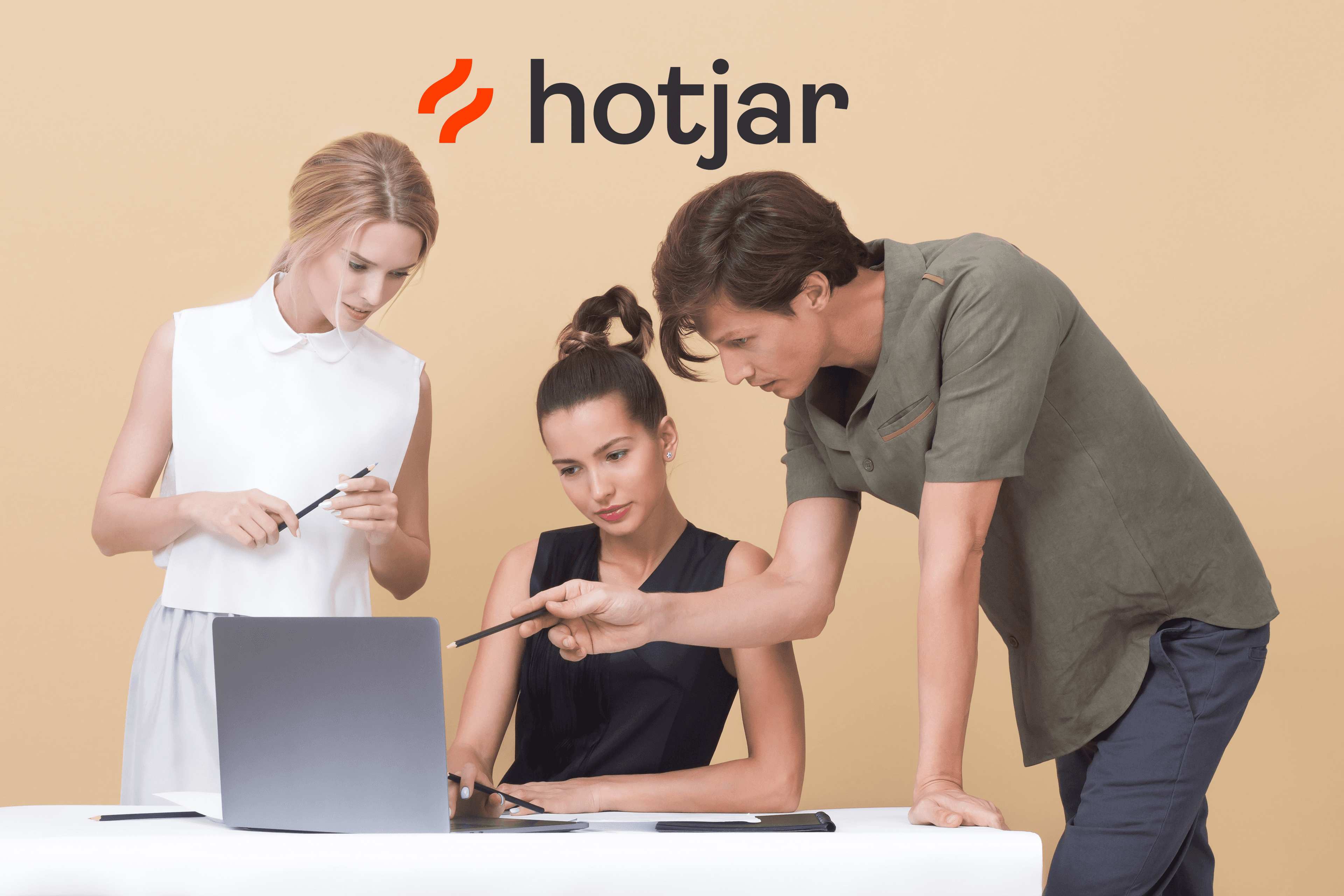 Team working on laptop with Hotjar logo on top